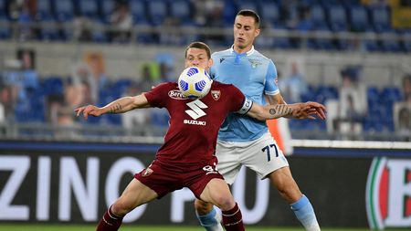 ROME, ITALY - MAY 18: Adam Marusic of SS Lazio competes for the ball with Andrea Belotti of Torino FC during the Serie A match between SS Lazio  and Torino FC at Stadio Olimpico on May 18, 2021 in Rome, Italy. The match, despite it's not postponed by Lega Serie A,  will not be played as Torino team need to observe a home quarantine until midnight on Tuesday due to Covd-19. (Photo by Marco Rosi - SS Lazio/Getty Images)