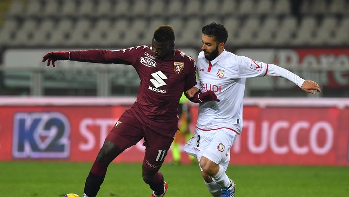 TURIN, ITALY - NOVEMBER 29: M Baye Niang (L) of Torino FC is challenged by Daniele Giorico of Carpi FC during the TIM Cup match between Torino FC and Carpi FC on November 29, 2017 in Turin, Italy. (Photo by Valerio Pennicino/Getty Images) TURIN, ITALY - NOVEMBER 29: M Baye Niang (L) of Torino FC is challenged by Daniele Giorico of Carpi FC during the TIM Cup match between Torino FC and Carpi FC on November 29, 2017 in Turin, Italy. (Photo by Valerio Pennicino/Getty Images)