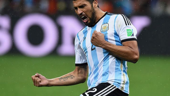 SAO PAULO, BRAZIL - JULY 09: Ezequiel Garay of Argentina celebrates scoring his penalty kick during a shootout during the 2014 FIFA World Cup Brazil Semi Final match between the Netherlands and Argentina at Arena de Sao Paulo on July 9, 2014 in Sao Paulo, Brazil. (Photo by Matthias Hangst/Getty Images) SAO PAULO, BRAZIL - JULY 09: Ezequiel Garay of Argentina celebrates scoring his penalty kick during a shootout during the 2014 FIFA World Cup Brazil Semi Final match between the Netherlands and Argentina at Arena de Sao Paulo on July 9, 2014 in Sao Paulo, Brazil. (Photo by Matthias Hangst/Getty Images)