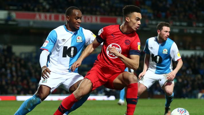 BLACKBURN, ENGLAND - DECEMBER 23: Antonee Robinson of Wigan Athletic turns away from Ryan Nyambe of Blackburn Rovers during the Sky Bet Championship match between Blackburn Rovers and Wigan Athletic at Ewood Park on December 23, 2019 in Blackburn, England. (Photo by Lewis Storey/Getty Images) 