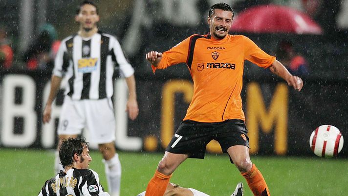 TORINO, ITALY - OCTOBER 28:  Alessandro Del Piero of Juventus and Luigi Sartor of Roma in action during the Serie A match between Juventus and Roma at the Delle Alpi Stadium on October 28, 2004 in Torino, Italy. (Photo by New Press/Getty Images) 