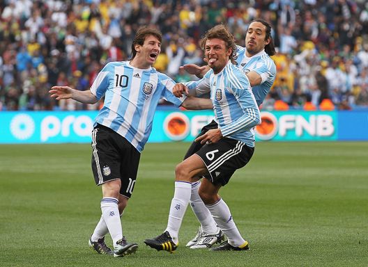 JOHANNESBURG, SOUTH AFRICA - JUNE 12: Gabriel Heinze of Argentina celebrates with teammates Lionel Messi (L) and Martin Demichelis (R) after he scores the opening goal during the 2010 FIFA World Cup South Africa Group B match between Argentina and Nigeria at Ellis Park Stadium on June 12, 2010 in Johannesburg, South Africa. (Photo by Chris McGrath/Getty Images) JOHANNESBURG, SOUTH AFRICA - JUNE 12: Gabriel Heinze of Argentina celebrates with teammates Lionel Messi (L) and Martin Demichelis (R) after he scores the opening goal during the 2010 FIFA World Cup South Africa Group B match between Argentina and Nigeria at Ellis Park Stadium on June 12, 2010 in Johannesburg, South Africa. (Photo by Chris McGrath/Getty Images)