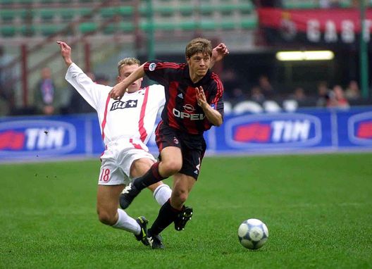 18 MAR 2001: Helveg Thomas of AC Milan  and Cassano of Bari in action  during the Serie A 23rd Round League match between Milan and Bari played at the Giuseppe Meazza San Siro Stadium Milan Italy. DIGITAL CAMERA Mandatory Credit: Grazia Neri/ALLSPORT 