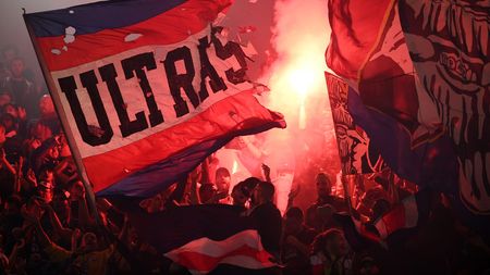 PARIS, FRANCE - SEPTEMBER 28: Paris Saint-Germain fans light red flares as they show their support during the UEFA Champions League group A match between Paris Saint-Germain and Manchester City at Parc des Princes on September 28, 2021 in Paris, France. (Photo by Matthias Hangst/Getty Images)