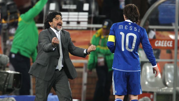 POLOKWANE, SOUTH AFRICA - JUNE 22: Diego Maradona head coach of Argentina celebrates victory with Lionel Messi during the 2010 FIFA World Cup South Africa Group B match between Greece and Argentina at Peter Mokaba Stadium on June 22, 2010 in Polokwane, South Africa. (Photo by Phil Cole/Getty Images) POLOKWANE, SOUTH AFRICA - JUNE 22: Diego Maradona head coach of Argentina celebrates victory with Lionel Messi during the 2010 FIFA World Cup South Africa Group B match between Greece and Argentina at Peter Mokaba Stadium on June 22, 2010 in Polokwane, South Africa. (Photo by Phil Cole/Getty Images)