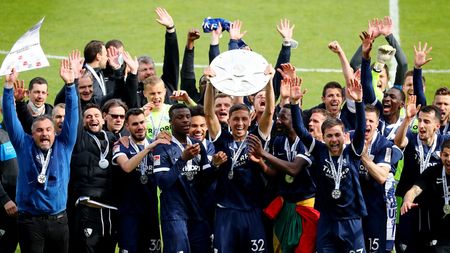 BOCHUM, GERMANY - MAY 23: Robert Zulj of Bochum lifts the Bundesliga 2 Meisterschale after winning after winning the Second Bundesliga match between VfL Bochum 1848 and SV Sandhausen at Vonovia Ruhrstadion on May 23, 2021 in Bochum, Germany. (Photo by Christof Koepsel/Getty Images)