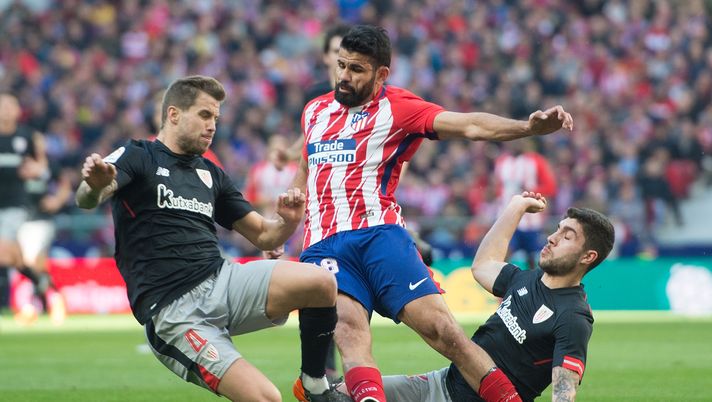 MADRID, SPAIN - FEBRUARY 18: Diego Costa of Atletico Madrid is tackled by Inigo Martinez (left) and Unai Nunez of Athletic Club during the La Liga match between Atletico Madrid and Athletic Club at estadio Wanda Metropolitano on February 18, 2018 in Madrid, Spain. (Photo by Denis Doyle/Getty Images) MADRID, SPAIN - FEBRUARY 18: Diego Costa of Atletico Madrid is tackled by Inigo Martinez (left) and Unai Nunez of Athletic Club during the La Liga match between Atletico Madrid and Athletic Club at estadio Wanda Metropolitano on February 18, 2018 in Madrid, Spain. (Photo by Denis Doyle/Getty Images)