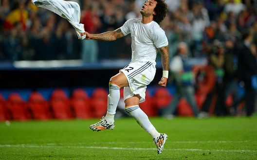 LISBON, PORTUGAL - MAY 24: Marcelo of Real Madrid celebrates victory at the final whistle in the UEFA Champions League Final between Real Madrid and Atletico de Madrid at Estadio da Luz on May 24, 2014 in Lisbon, Portugal. (Photo by Michael Regan/Getty Images) LISBON, PORTUGAL - MAY 24: Marcelo of Real Madrid celebrates victory at the final whistle in the UEFA Champions League Final between Real Madrid and Atletico de Madrid at Estadio da Luz on May 24, 2014 in Lisbon, Portugal. (Photo by Michael Regan/Getty Images)
