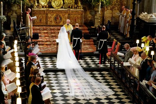 WINDSOR, UNITED KINGDOM - MAY 19: Prince Harry and Meghan Markle during their wedding ceremony in St George's Chapel at Windsor Castle on May 19, 2018 in Windsor, England. (Photo by Owen Humphreys - WPA Pool/Getty Images) WINDSOR, UNITED KINGDOM - MAY 19: Prince Harry and Meghan Markle during their wedding ceremony in St George's Chapel at Windsor Castle on May 19, 2018 in Windsor, England. (Photo by Owen Humphreys - WPA Pool/Getty Images)