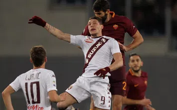  ROME, ITALY - FEBRUARY 19: Federico Fazio of AS Roma competes for the ball with Andrea Belotti #9 of FC Torino during the Serie A match between AS Roma and FC Torino at Stadio Olimpico on February 19, 2017 in Rome, Italy. (Photo by Paolo Bruno/Getty Images)