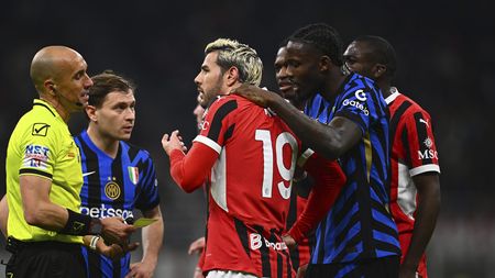 MILAN, ITALY - APRIL 02: Marcus Thuram of FC Internazionale and Theo Hernandez of AC Milan speaks with the referee Micheal Fabbri during the Coppa Italia Semi Final match between AC Milan and FC Internazionale at Stadio Giuseppe Meazza on April 02, 2025 in Milan, Italy. (Photo by Mattia Ozbot - Inter/Inter via Getty Images)