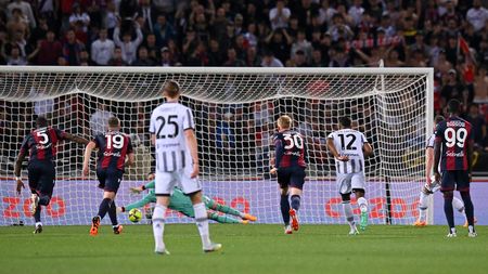 BOLOGNA, ITALY - APRIL 30: Arkadiusz Milik of Juventus has a penalty kick saved by Lukasz Skorupski of Bologna FC during the Serie A match between Bologna FC and Juventus at Stadio Renato Dall'Ara on April 30, 2023 in Bologna, Italy. (Photo by Alessandro Sabattini/Getty Images)