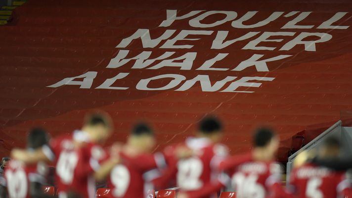 LIVERPOOL, ENGLAND - OCTOBER 31: A You'll Never Walk Alone banner is seen as Liverpool players observe a minutes silence in memory of former England player, Nobby Stiles MBE, as well as to mark Armistice Day prior to the Premier League match between Liverpool and West Ham United at Anfield on October 31, 2020 in Liverpool, England. Sporting stadiums around the UK remain under strict restrictions due to the Coronavirus Pandemic as Government social distancing laws prohibit fans inside venues resulting in games being played behind closed doors. (Photo by Peter Powell - Pool/Getty Images) LIVERPOOL, ENGLAND - OCTOBER 31: A You'll Never Walk Alone banner is seen as Liverpool players observe a minutes silence in memory of former England player, Nobby Stiles MBE, as well as to mark Armistice Day prior to the Premier League match between Liverpool and West Ham United at Anfield on October 31, 2020 in Liverpool, England. Sporting stadiums around the UK remain under strict restrictions due to the Coronavirus Pandemic as Government social distancing laws prohibit fans inside venues resulting in games being played behind closed doors. (Photo by Peter Powell - Pool/Getty Images)