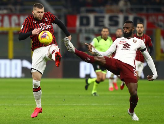  MILAN, ITALY - JANUARY 28: Ante Rebic of AC Milan competes for the ball with Nicolas Nkoulou of Torino during the Coppa Italia Quarter Final match between AC Milan and Torino at San Siro on January 28, 2020 in Milan, Italy. (Photo by Marco Luzzani/Getty Images) 