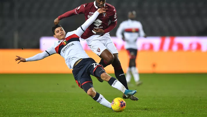 TURIN, ITALY - JANUARY 09:  Nicolas Nkoulou (R) of Torino FC tackles Kevin Agudello of Genoa CFC during the Coppa Italia match between Torino FC and Genoa CFC at Stadio Olimpico Grande Torino on January 9, 2020 in Turin, Italy.  (Photo by Valerio Pennicino/Getty Images)