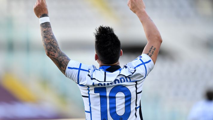 TURIN, ITALY - MARCH 14: Lautaro Martinez of Internazionale celebrates after scoring their side's second goal during the Serie A match between Torino FC and FC Internazionale at Stadio Olimpico di Torino on March 14, 2021 in Turin, Italy. Sporting stadiums around Italy remain under strict restrictions due to the Coronavirus Pandemic as Government social distancing laws prohibit fans inside venues resulting in games being played behind closed doors. (Photo by Valerio Pennicino/Getty Images) TURIN, ITALY - MARCH 14: Lautaro Martinez of Internazionale celebrates after scoring their side's second goal during the Serie A match between Torino FC and FC Internazionale at Stadio Olimpico di Torino on March 14, 2021 in Turin, Italy. Sporting stadiums around Italy remain under strict restrictions due to the Coronavirus Pandemic as Government social distancing laws prohibit fans inside venues resulting in games being played behind closed doors. (Photo by Valerio Pennicino/Getty Images)