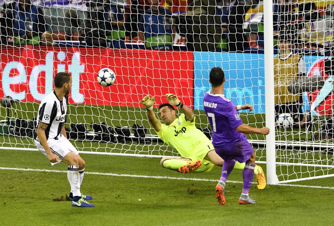  CARDIFF, WALES - JUNE 03:  In this handout image provided by UEFA, Cristiano Ronaldo of Real Madrid scores his sides third goal during the UEFA Champions League Final between Juventus and Real Madrid at National Stadium of Wales on June 3, 2017 in Cardiff, Wales.  (Photo by Handout/UEFA via Getty Images) 
