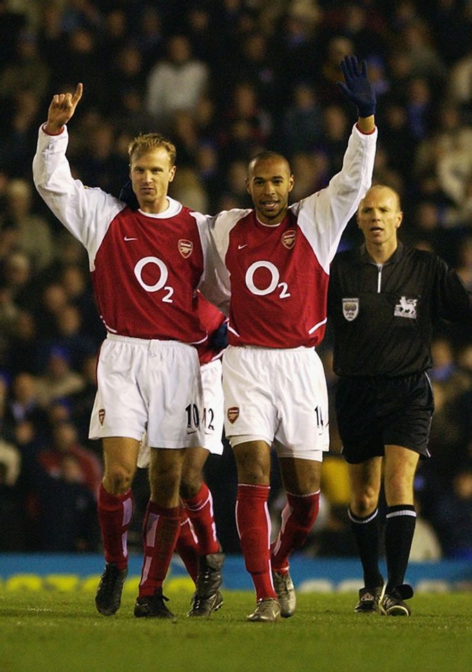 BIRMINGHAM - JANUARY 12: Thierry Henry of Arsenal celebrates scoring his 100th goal for Arsenal with Dennis Bergkamp of Arsenal during the FA Barclaycard Premiership match between Birmingham City and Arsenal held on January 12, 2003 at St Andrews in Birmingham, England. Arsenal won the match 4-0. (Photo by Shaun Botterill/Getty Images) BIRMINGHAM - JANUARY 12: Thierry Henry of Arsenal celebrates scoring his 100th goal for Arsenal with Dennis Bergkamp of Arsenal during the FA Barclaycard Premiership match between Birmingham City and Arsenal held on January 12, 2003 at St Andrews in Birmingham, England. Arsenal won the match 4-0. (Photo by Shaun Botterill/Getty Images)