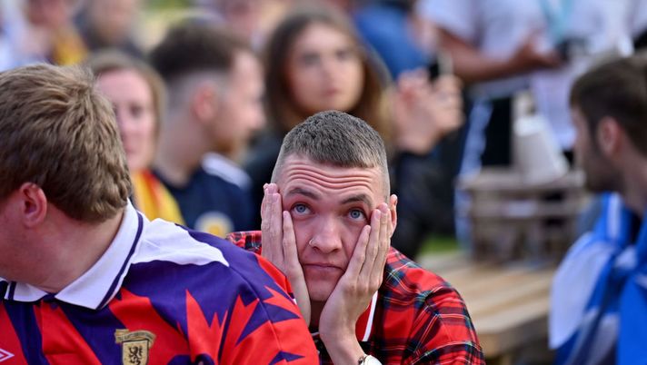GLASGOW, SCOTLAND - JUNE 22: Scottish fans react as they watch the UEFA Euro 2020 Championship Group D match between Croatia and Scotland in the FanZone on June 18, 2021 in Glasgow, Scotland. Scotland play Croatia hoping to progress from the group stages of the Euro 2020 competition. Key Scotland player, Billy Gilmore, has contracted Covid-19 and will not play. (Photo by Jeff J Mitchell/Getty Images) GLASGOW, SCOTLAND - JUNE 22: Scottish fans react as they watch the UEFA Euro 2020 Championship Group D match between Croatia and Scotland in the FanZone on June 18, 2021 in Glasgow, Scotland. Scotland play Croatia hoping to progress from the group stages of the Euro 2020 competition. Key Scotland player, Billy Gilmore, has contracted Covid-19 and will not play. (Photo by Jeff J Mitchell/Getty Images)