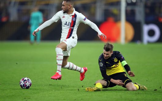 DORTMUND, GERMANY - FEBRUARY 18: Lukas Piszczek of Dortmund is challenged by Layvin Kurzawa of Paris Saint-Germain during the UEFA Champions League round of 16 first leg match between Borussia Dortmund and Paris Saint-Germain at Signal Iduna Park on February 18, 2020 in Dortmund, Germany. (Photo by Alex Grimm/Getty Images) DORTMUND, GERMANY - FEBRUARY 18: Lukas Piszczek of Dortmund is challenged by Layvin Kurzawa of Paris Saint-Germain during the UEFA Champions League round of 16 first leg match between Borussia Dortmund and Paris Saint-Germain at Signal Iduna Park on February 18, 2020 in Dortmund, Germany. (Photo by Alex Grimm/Getty Images)