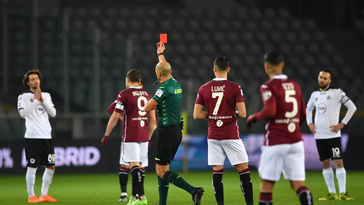 TURIN, ITALY - JANUARY 16: Referee,  Michael Fabbri shows Luca Vignali of Spezia a red card during the Serie A match between Torino FC and Spezia Calcio at Stadio Olimpico di Torino on January 16, 2021 in Turin, Italy. Sporting stadiums around Italy remain under strict restrictions due to the Coronavirus Pandemic as Government social distancing laws prohibit fans inside venues resulting in games being played behind closed doors. (Photo by Valerio Pennicino/Getty Images)