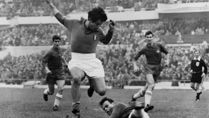 13th June 1962: Omar Sivori (of Italy and Argentina) leaping over Elsener (of Switzerland) during a World Cup match between Italy and Switzerland. (Photo by Keystone/Getty Images) 13th June 1962: Omar Sivori (of Italy and Argentina) leaping over Elsener (of Switzerland) during a World Cup match between Italy and Switzerland. (Photo by Keystone/Getty Images)