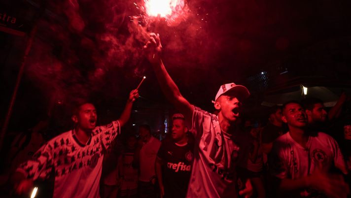 SAO PAULO, BRAZIL - JANUARY 30: Fans of Palmeiras near Palmeiras clubhouse and stadium celebrate after Palmeiras won the match between Palmeiras and Santos as part of Copa CONMEBOL Libertadores 2020 Final on January 30, 2021 in Sao Paulo, Brazil. The match takes place at Maracana Stadium in Rio de Janeiro. (Photo by Miguel Schincariol/Getty Images) SAO PAULO, BRAZIL - JANUARY 30: Fans of Palmeiras near Palmeiras clubhouse and stadium celebrate after Palmeiras won the match between Palmeiras and Santos as part of Copa CONMEBOL Libertadores 2020 Final on January 30, 2021 in Sao Paulo, Brazil. The match takes place at Maracana Stadium in Rio de Janeiro. (Photo by Miguel Schincariol/Getty Images)