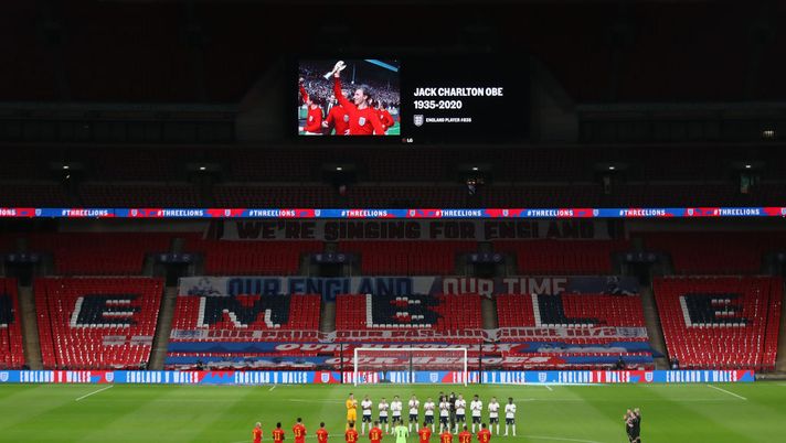 LONDON, ENGLAND - OCTOBER 08: Both teams and officials stand for a minutes silence in honor of past England players who have passed away during the international friendly match between England and Wales at Wembley Stadium on October 08, 2020 in London, England. Sporting stadiums around the UK remain under strict restrictions due to the Coronavirus Pandemic as Government social distancing laws prohibit fans inside venues resulting in games being played behind closed doors. (Photo by Carl Recine - Pool/Getty Images) LONDON, ENGLAND - OCTOBER 08: Both teams and officials stand for a minutes silence in honor of past England players who have passed away during the international friendly match between England and Wales at Wembley Stadium on October 08, 2020 in London, England. Sporting stadiums around the UK remain under strict restrictions due to the Coronavirus Pandemic as Government social distancing laws prohibit fans inside venues resulting in games being played behind closed doors. (Photo by Carl Recine - Pool/Getty Images)