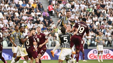 TURIN, ITALY - OCTOBER 7: Federico Gatti of Juventus FC head the ball against Raoul Bellanova of Torino FC during the Serie A TIM match between Juventus and Torino FC at on October 7, 2023 in Turin, Italy. (Photo by Stefano Guidi/Getty Images)