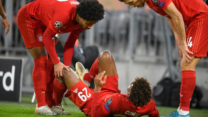 MUNICH, GERMANY - DECEMBER 11: Kingsley Coman of FC Bayern Munich reacts after going down with an injury during the UEFA Champions League group B match between Bayern Muenchen and Tottenham Hotspur at Allianz Arena on December 11, 2019 in Munich, Germany. (Photo by Michael Regan/Getty Images) 
