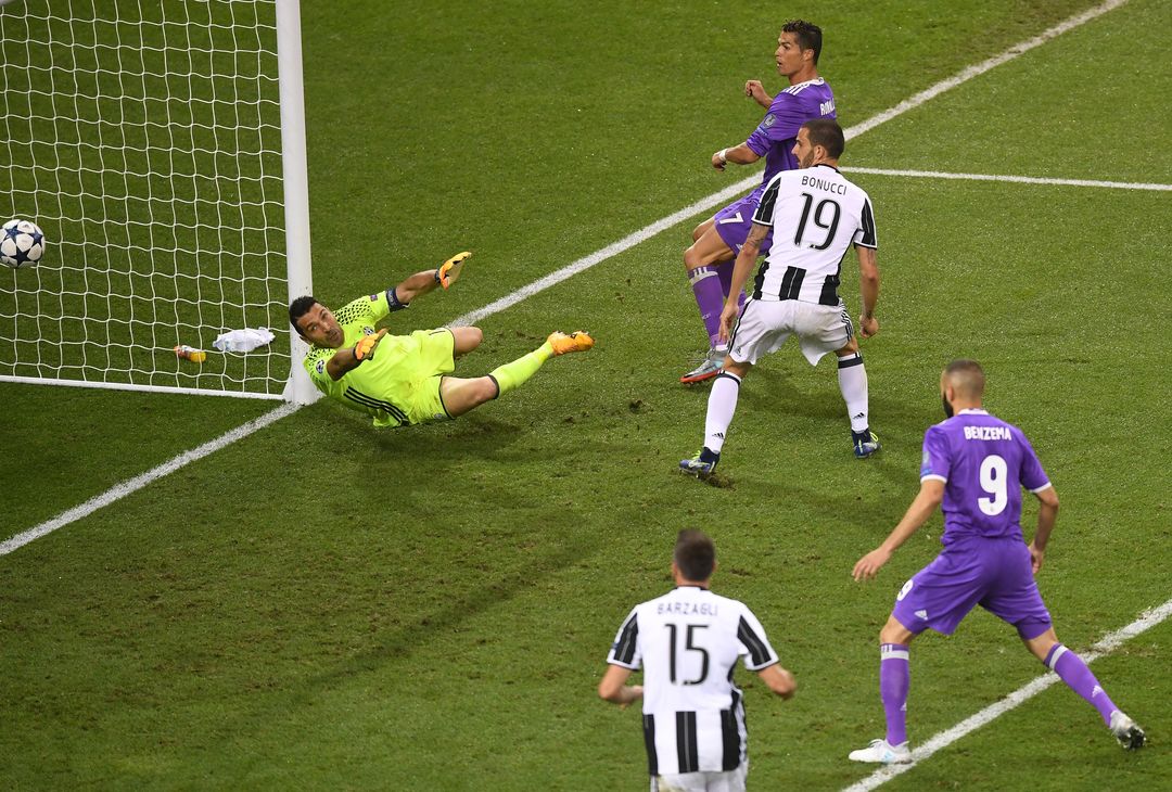  CARDIFF, WALES - JUNE 03: Cristiano Ronaldo of Real Madrid scores his sides third goal during the UEFA Champions League Final between Juventus and Real Madrid at National Stadium of Wales on June 3, 2017 in Cardiff, Wales.  (Photo by Michael Regan/Getty Images) 