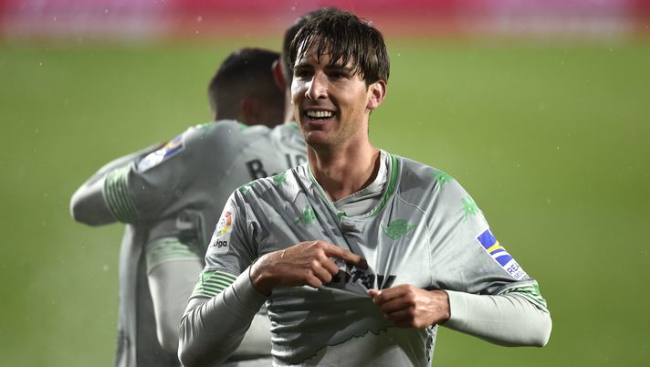 PAMPLONA, SPAIN - DECEMBER 06: Juan Miranda of Real Betis celebrates after scoring their sides second goal during the La Liga Santander match between C.A. Osasuna and Real Betis at Estadio El Sadar on December 06, 2020 in Pamplona, Spain. Sporting stadiums around Spain remain under strict restrictions due to the Coronavirus Pandemic as Government social distancing laws prohibit fans inside venues resulting in games being played behind closed doors. (Photo by Juan Manuel Serrano Arce/Getty Images) PAMPLONA, SPAIN - DECEMBER 06: Juan Miranda of Real Betis celebrates after scoring their sides second goal during the La Liga Santander match between C.A. Osasuna and Real Betis at Estadio El Sadar on December 06, 2020 in Pamplona, Spain. Sporting stadiums around Spain remain under strict restrictions due to the Coronavirus Pandemic as Government social distancing laws prohibit fans inside venues resulting in games being played behind closed doors. (Photo by Juan Manuel Serrano Arce/Getty Images)