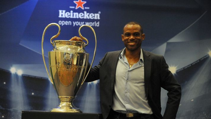 LAGOS, NIGERIA - MARCH 15: Former Nigerian international Sunday Oliseh poses with UEFA Trophy displayed for public viewing at Eko Hotel on March 15, 2014 in Lagos, Nigeria. Football fans were given the opportunity to visit with the Heineken UEFA Champions League Trophy which began a three-nation tour in Nigeria under the auspices of Champions League partner, Heineken. Fans took photographs with the brand ambassador, former Real Madrid and ex-international football star Christian Karembeu. (Photo by Pius Utomi Ekpei/Getty Images) LAGOS, NIGERIA - MARCH 15: Former Nigerian international Sunday Oliseh poses with UEFA Trophy displayed for public viewing at Eko Hotel on March 15, 2014 in Lagos, Nigeria. Football fans were given the opportunity to visit with the Heineken UEFA Champions League Trophy which began a three-nation tour in Nigeria under the auspices of Champions League partner, Heineken. Fans took photographs with the brand ambassador, former Real Madrid and ex-international football star Christian Karembeu. (Photo by Pius Utomi Ekpei/Getty Images)