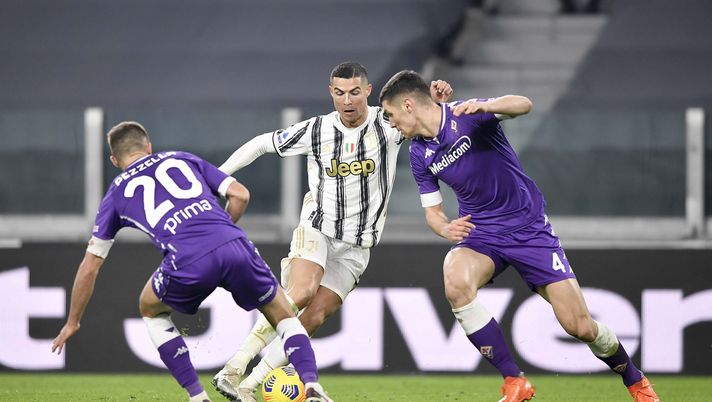TURIN, ITALY - DECEMBER 22: Cristiano Ronaldo of Juventus competes for the ball with German Pezzella and Nikola Milenkovic of ACF Fiorentina during the Serie A match between Juventus and ACF Fiorentina at Allianz Stadium on December 22, 2020 in Turin, Italy. Sporting stadiums around Italy remain under strict restrictions due to the Coronavirus Pandemic as Government social distancing laws prohibit fans inside venues resulting in games being played behind closed doors. (Photo by Daniele Badolato - Juventus FC/Juventus FC via Getty Images) TURIN, ITALY - DECEMBER 22: Cristiano Ronaldo of Juventus competes for the ball with German Pezzella and Nikola Milenkovic of ACF Fiorentina during the Serie A match between Juventus and ACF Fiorentina at Allianz Stadium on December 22, 2020 in Turin, Italy. Sporting stadiums around Italy remain under strict restrictions due to the Coronavirus Pandemic as Government social distancing laws prohibit fans inside venues resulting in games being played behind closed doors. (Photo by Daniele Badolato - Juventus FC/Juventus FC via Getty Images)