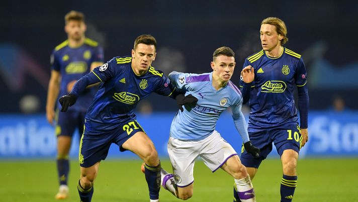 ZAGREB, CROATIA - DECEMBER 11: Phil Foden of Manchester City is challenged by Nikola Moro and Lovro Majer of GNK Dinamo Zagreb during the UEFA Champions League group C match between Dinamo Zagreb and Manchester City at Maksimir Stadium on December 11, 2019 in Zagreb, Croatia. (Photo by Dan Mullan/Getty Images) ZAGREB, CROATIA - DECEMBER 11: Phil Foden of Manchester City is challenged by Nikola Moro and Lovro Majer of GNK Dinamo Zagreb during the UEFA Champions League group C match between Dinamo Zagreb and Manchester City at Maksimir Stadium on December 11, 2019 in Zagreb, Croatia. (Photo by Dan Mullan/Getty Images)