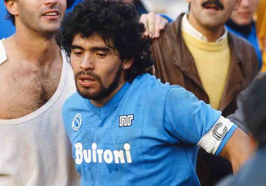 TURIN, ITALY - MARCH 09: Napoli captain Diego Maradona (r) leaves the field with Juventus player Antonio Cabrini after the Serie A match between the sides on March 9, 1986 in Turin, Italy.  (Photo by David Cannon/Allsport/Getty Images) 