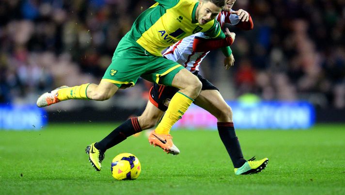 SUNDERLAND ENGLAND, DECEMBER 21: Ricky Van Wolfswinkel of Norwich City challenges Sebastian Larsson of Sunderland during the Barclays Premier League match between Sunderland and Norwich City at the Stadium of Light on December 21, 2013 in Sunderland, England. (Photo by Mark Runnacles/Getty Images) SUNDERLAND ENGLAND, DECEMBER 21: Ricky Van Wolfswinkel of Norwich City challenges Sebastian Larsson of Sunderland during the Barclays Premier League match between Sunderland and Norwich City at the Stadium of Light on December 21, 2013 in Sunderland, England. (Photo by Mark Runnacles/Getty Images)