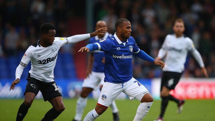 OLDHAM, ENGLAND - AUGUST 14: Gevaro Nepomuceno of Oldham Athletic holds off a challenge from Florian Jozefzoon of Derby County during the Carabao Cup First Round match between Oldham Athletic and Derby County at Boundary Park on August 14, 2018 in Oldham, England. (Photo by Alex Livesey/Getty Images) OLDHAM, ENGLAND - AUGUST 14: Gevaro Nepomuceno of Oldham Athletic holds off a challenge from Florian Jozefzoon of Derby County during the Carabao Cup First Round match between Oldham Athletic and Derby County at Boundary Park on August 14, 2018 in Oldham, England. (Photo by Alex Livesey/Getty Images)