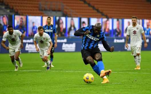 MILAN, ITALY - NOVEMBER 22: Romelu Lukaku of Inter Milan scores their sides third goal from the penalty spot during the Serie A match between FC Internazionale and Torino FC at Stadio Giuseppe Meazza on November 22, 2020 in Milan, Italy. Sporting stadiums around Italy remain under strict restrictions due to the Coronavirus Pandemic as Government social distancing laws prohibit fans inside venues resulting in games being played behind closed doors. (Photo by Valerio Pennicino/Getty Images) MILAN, ITALY - NOVEMBER 22: Romelu Lukaku of Inter Milan scores their sides third goal from the penalty spot during the Serie A match between FC Internazionale and Torino FC at Stadio Giuseppe Meazza on November 22, 2020 in Milan, Italy. Sporting stadiums around Italy remain under strict restrictions due to the Coronavirus Pandemic as Government social distancing laws prohibit fans inside venues resulting in games being played behind closed doors. (Photo by Valerio Pennicino/Getty Images)