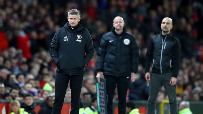 MANCHESTER, ENGLAND - JANUARY 07: Ole Gunnar Solskjaer, Manager of Manchester United looks on as Pep Guardiola, Manager of Manchester City reacts during the Carabao Cup Semi Final match between Manchester United and Manchester City at Old Trafford on January 07, 2020 in Manchester, England. (Photo by Michael Steele/Getty Images) MANCHESTER, ENGLAND - JANUARY 07: Ole Gunnar Solskjaer, Manager of Manchester United looks on as Pep Guardiola, Manager of Manchester City reacts during the Carabao Cup Semi Final match between Manchester United and Manchester City at Old Trafford on January 07, 2020 in Manchester, England. (Photo by Michael Steele/Getty Images)