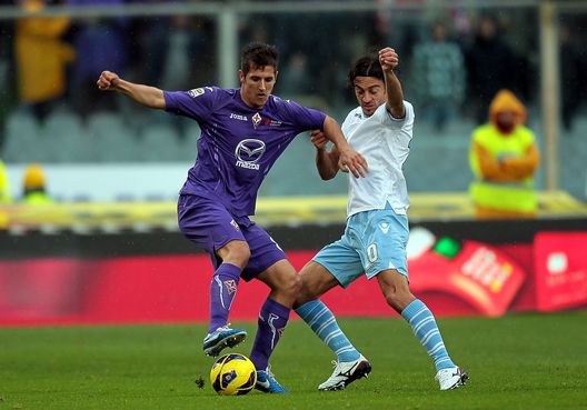 FLORENCE, ITALY - OCTOBER 28: Stevan Jovetic (L) of ACF Fiorentina fights for the ball with Giuseppe Biava of SS Lazio during the Serie A match between ACF Fiorentina and S.S. Lazio at Stadio Artemio Franchi on October 28, 2012 in Florence, Italy. (Photo by Gabriele Maltinti/Getty Images) FLORENCE, ITALY - OCTOBER 28: Stevan Jovetic (L) of ACF Fiorentina fights for the ball with Giuseppe Biava of SS Lazio during the Serie A match between ACF Fiorentina and S.S. Lazio at Stadio Artemio Franchi on October 28, 2012 in Florence, Italy. (Photo by Gabriele Maltinti/Getty Images)