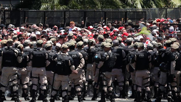 BUENOS AIRES, ARGENTINA - NOVEMBER 25: Riot police stand guard outside of Monumental Stadium of River Plate before the second leg of the final of Copa CONMEBOL Libertadores 2018 between River Plate and Boca Juniors at Estadio Monumental Antonio Vespucio Liberti on November 25, 2018 in Buenos Aires, Argentina. The match was postponed again today due to the attacks suffered by players of Boca Juniors on their arrival to the stadium yesterday. (Photo by Marcelo Hernandez/Getty Images) BUENOS AIRES, ARGENTINA - NOVEMBER 25: Riot police stand guard outside of Monumental Stadium of River Plate before the second leg of the final of Copa CONMEBOL Libertadores 2018 between River Plate and Boca Juniors at Estadio Monumental Antonio Vespucio Liberti on November 25, 2018 in Buenos Aires, Argentina. The match was postponed again today due to the attacks suffered by players of Boca Juniors on their arrival to the stadium yesterday. (Photo by Marcelo Hernandez/Getty Images)