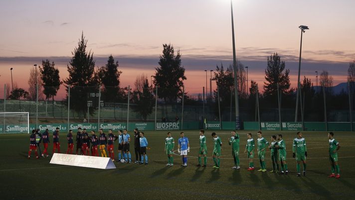 CORNELLA, SPAIN - JANUARY 06: Atletico de Madrid and Cornella players prior the Copa del Rey second round match between Cornella and Atletico Madrid at Nou Municipal de Cornella de Llobregat on January 06, 2021 in Cornella, Spain. Sporting stadiums around Spain remain under strict restrictions due to the Coronavirus Pandemic as Government social distancing laws prohibit fans inside venues resulting in games being played behind closed doors. (Photo by Eric Alonso/Getty Images) CORNELLA, SPAIN - JANUARY 06: Atletico de Madrid and Cornella players prior the Copa del Rey second round match between Cornella and Atletico Madrid at Nou Municipal de Cornella de Llobregat on January 06, 2021 in Cornella, Spain. Sporting stadiums around Spain remain under strict restrictions due to the Coronavirus Pandemic as Government social distancing laws prohibit fans inside venues resulting in games being played behind closed doors. (Photo by Eric Alonso/Getty Images)