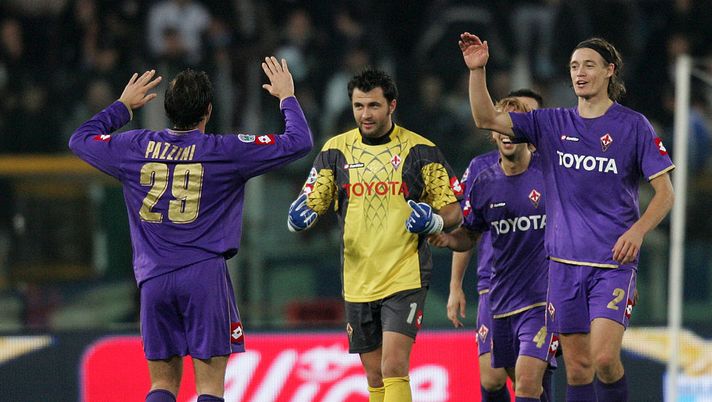 ROME - NOVEMBER 03:  Giampaolo Pazzini (L) celebrates with Fiorentina teammates goalkeeper Sebastian Frey, Per Kroldrup and Marco Donadel after scoring the first goal of the Serie A match between SS Lazio and ACF Fiorentina at the Stadio Olimpico on November 03, 2007 in Rome, Italy.  (Photo by NewPress/Getty Images) 