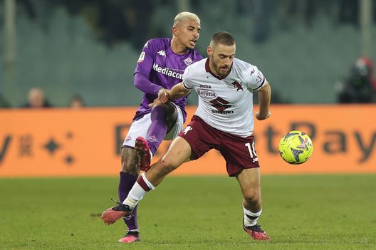 FLORENCE, ITALY - FEBRUARY 01: Domilson Cordeiro dos Santos known as Dodo of ACF Fiorentina in action against Nikola Vlasic of Torino FC during the Coppa Italia Quarter Final matcy between Fiorentina and Torino at Stadio Artemio Franchi on February 1, 2023 in Florence, Italy. (Photo by Gabriele Maltinti/Getty Images)