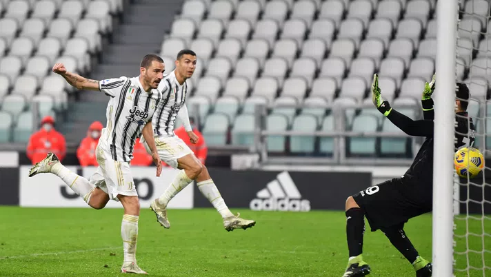 TURIN, ITALY - DECEMBER 05: Leonardo Bonucci of Juventus scores his sides second goal during the Serie A match between Juventus and Torino FC at Allianz Stadium on December 05, 2020 in Turin, Italy. Football Stadiums around Italy remain empty due to the Coronavirus Pandemic as Government social distancing laws prohibit fans inside venues resulting in fixtures being played behind closed doors. (Photo by Valerio Pennicino/Getty Images)