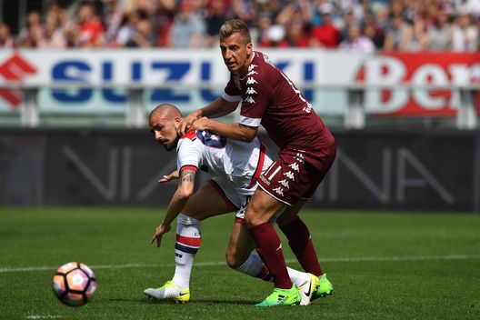  TURIN, ITALY - APRIL 15: Maxi Lopez (R) of FC Torino competes with Bruno Martella of FC Crotone during the Serie A match between FC Torino and FC Crotone at Stadio Olimpico di Torino on April 15, 2017 in Turin, Italy. (Photo by Valerio Pennicino/Getty Images) 