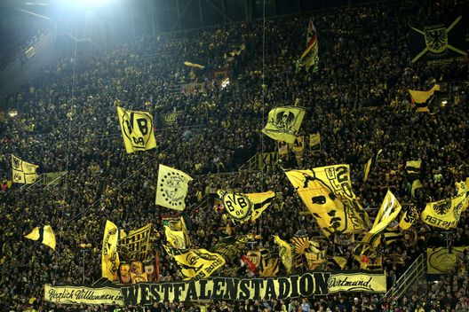 DORTMUND, NORTH RHINE-WESTPHALIA - OCTOBER 24: Borussia Dortmund fans are seen during the Group A match of the UEFA Champions League between Borussia Dortmund and Club Atletico de Madrid at Signal Iduna Park on October 24, 2018 in Dortmund, Germany. (Photo by Christof Koepsel/Bongarts/Getty Images) DORTMUND, NORTH RHINE-WESTPHALIA - OCTOBER 24: Borussia Dortmund fans are seen during the Group A match of the UEFA Champions League between Borussia Dortmund and Club Atletico de Madrid at Signal Iduna Park on October 24, 2018 in Dortmund, Germany. (Photo by Christof Koepsel/Bongarts/Getty Images)