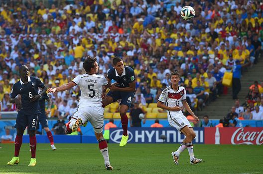 RIO DE JANEIRO, BRAZIL - JULY 04: Mats Hummels of Germany scores his team's first goal against Raphael Varane of France during the 2014 FIFA World Cup Brazil Quarter Final match between France and Germany at Maracana on July 4, 2014 in Rio de Janeiro, Brazil. (Photo by Matthias Hangst/Getty Images) RIO DE JANEIRO, BRAZIL - JULY 04: Mats Hummels of Germany scores his team's first goal against Raphael Varane of France during the 2014 FIFA World Cup Brazil Quarter Final match between France and Germany at Maracana on July 4, 2014 in Rio de Janeiro, Brazil. (Photo by Matthias Hangst/Getty Images)