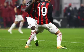  MILAN, ITALY - DECEMBER 13: Theo Hernandez of A.C. Milan celebrates after scoring their team's second goal with teammate Franck Kessie during the Serie A match between AC Milan and Parma Calcio at Stadio Giuseppe Meazza on December 13, 2020 in Milan, Italy. Sporting stadiums around Italy remain under strict restrictions due to the Coronavirus Pandemic as Government social distancing laws prohibit fans inside venues resulting in games being played behind closed doors. (Photo by Marco Luzzani/Getty Images)